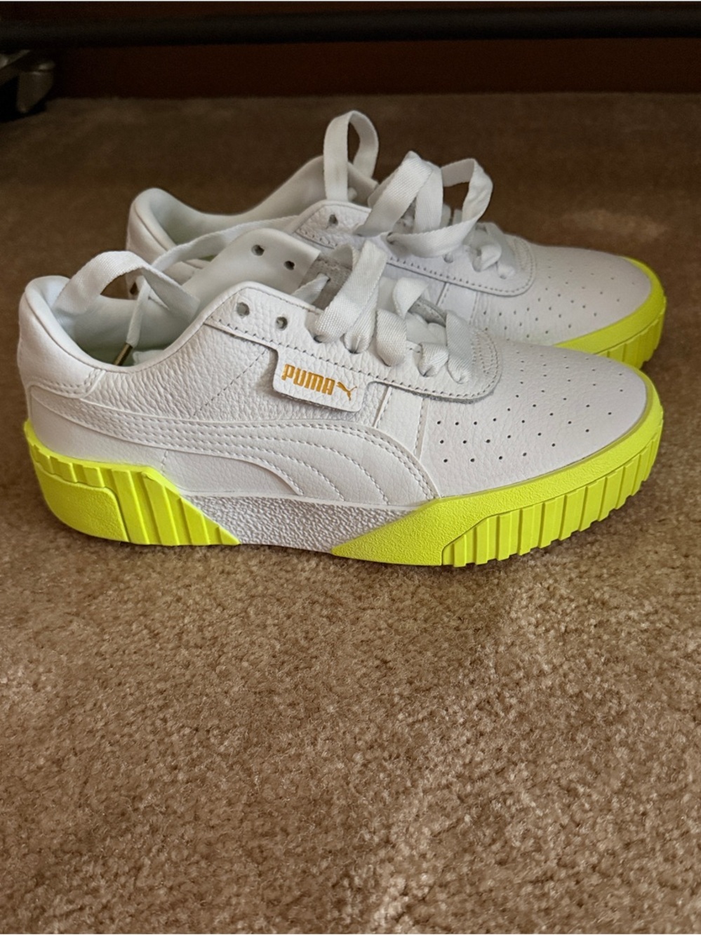 Puma women’s White Sneakers with Neon Yellow Sole Accent